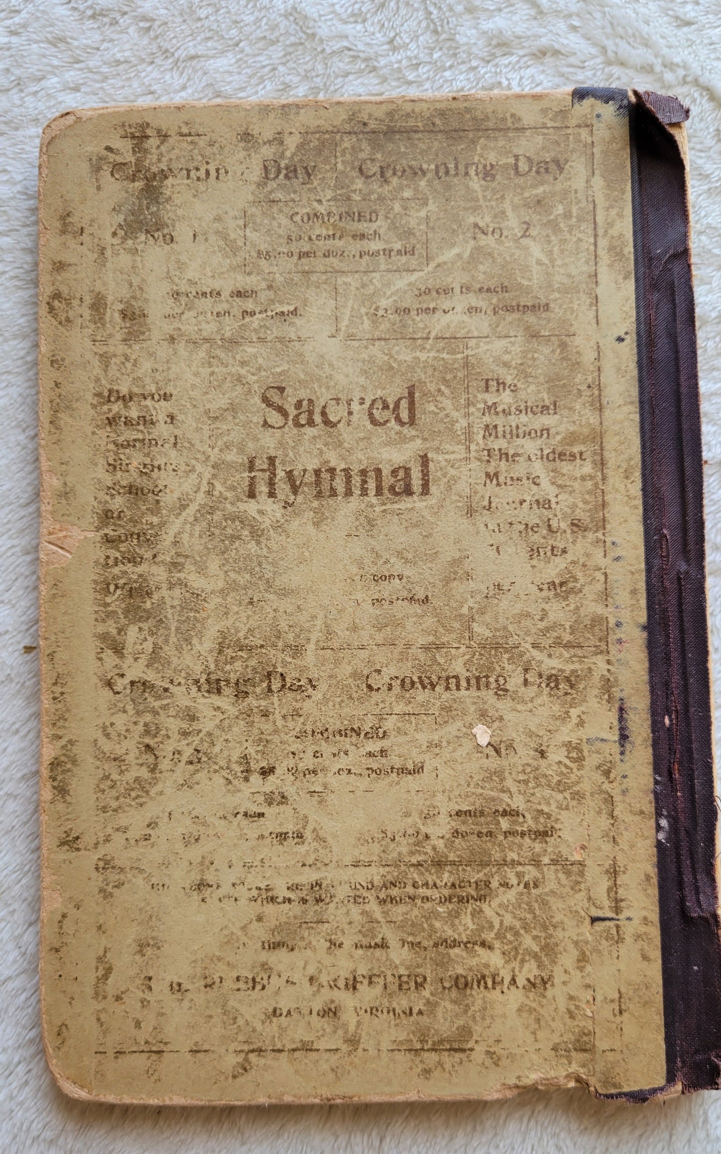 Antique book Crowning Day No. 5 is a Christian hymn book, copyrighted in 1902 by J. H. Hall, W. H. Ruebush, and J. H. Ruebush and published by the Ruebush-Kieffer Company, Dayton, Virginia. View of back cover.
