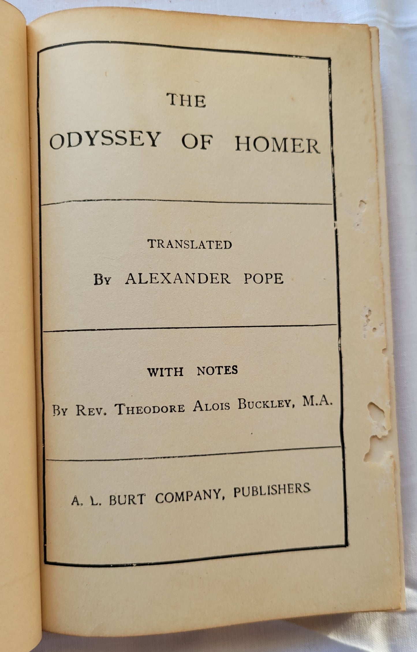 Antique book for sale, Homer's ancient Greek epic, The Odyssey translated by Alexander Pope, published by A. L. Burt Company (before 1932), with notes from Rev. Theodore Alois Buckley M.A. View of inside title page.
