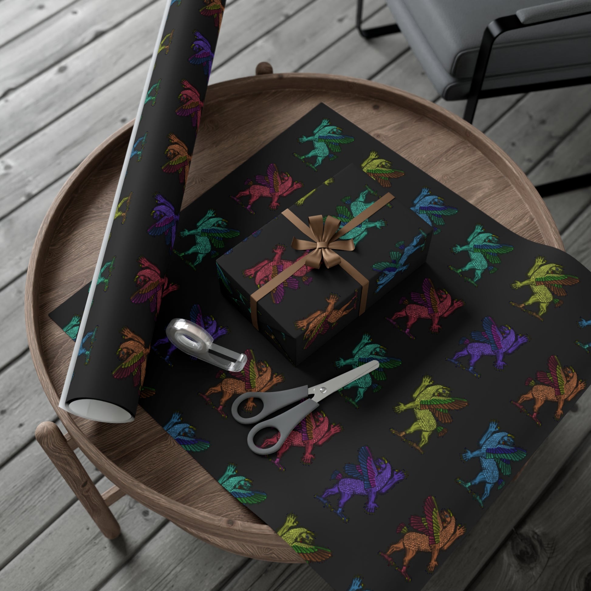Black wrapping paper with a pattern of an ancient engraving of Tiamat in multiple colors.