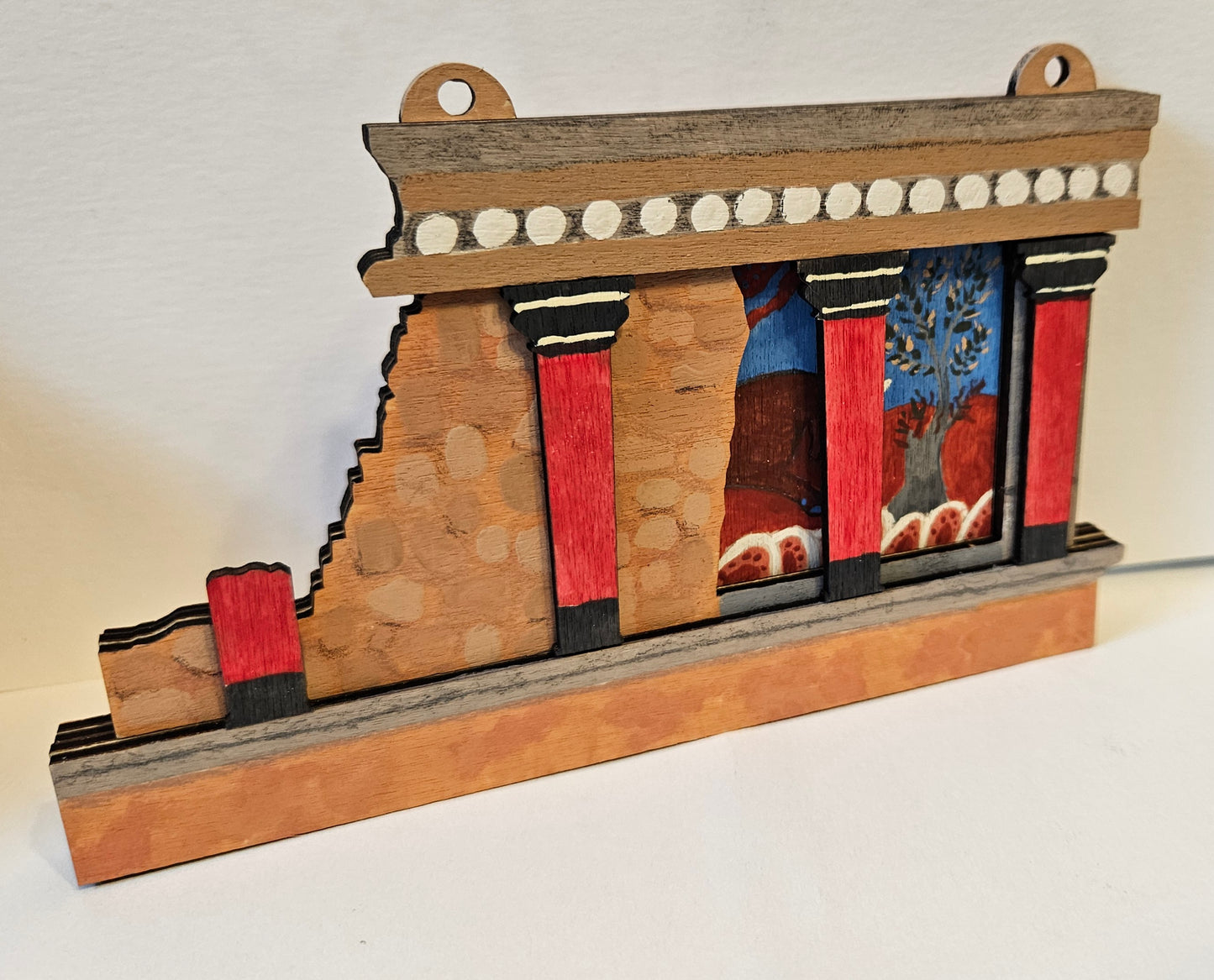 handmade recreation of a Minoan bull fresco and columns from Knossos palace on Crete in Greece