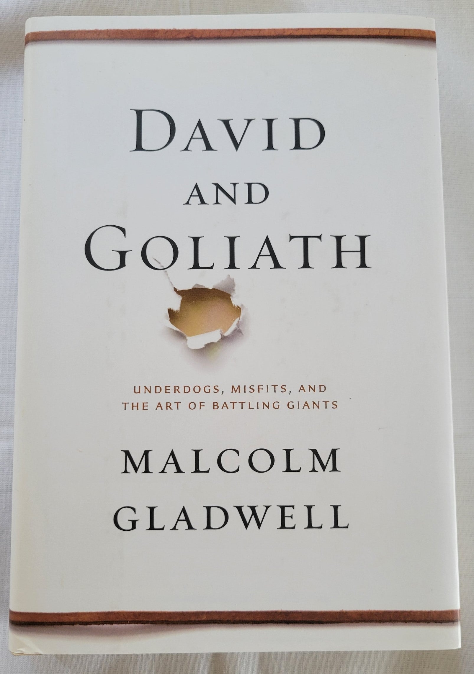 Used book David and Goliath: Underdogs, Misfits, and the Art of Battling Giants, written by Malcolm Gladwell.  View of front cover.