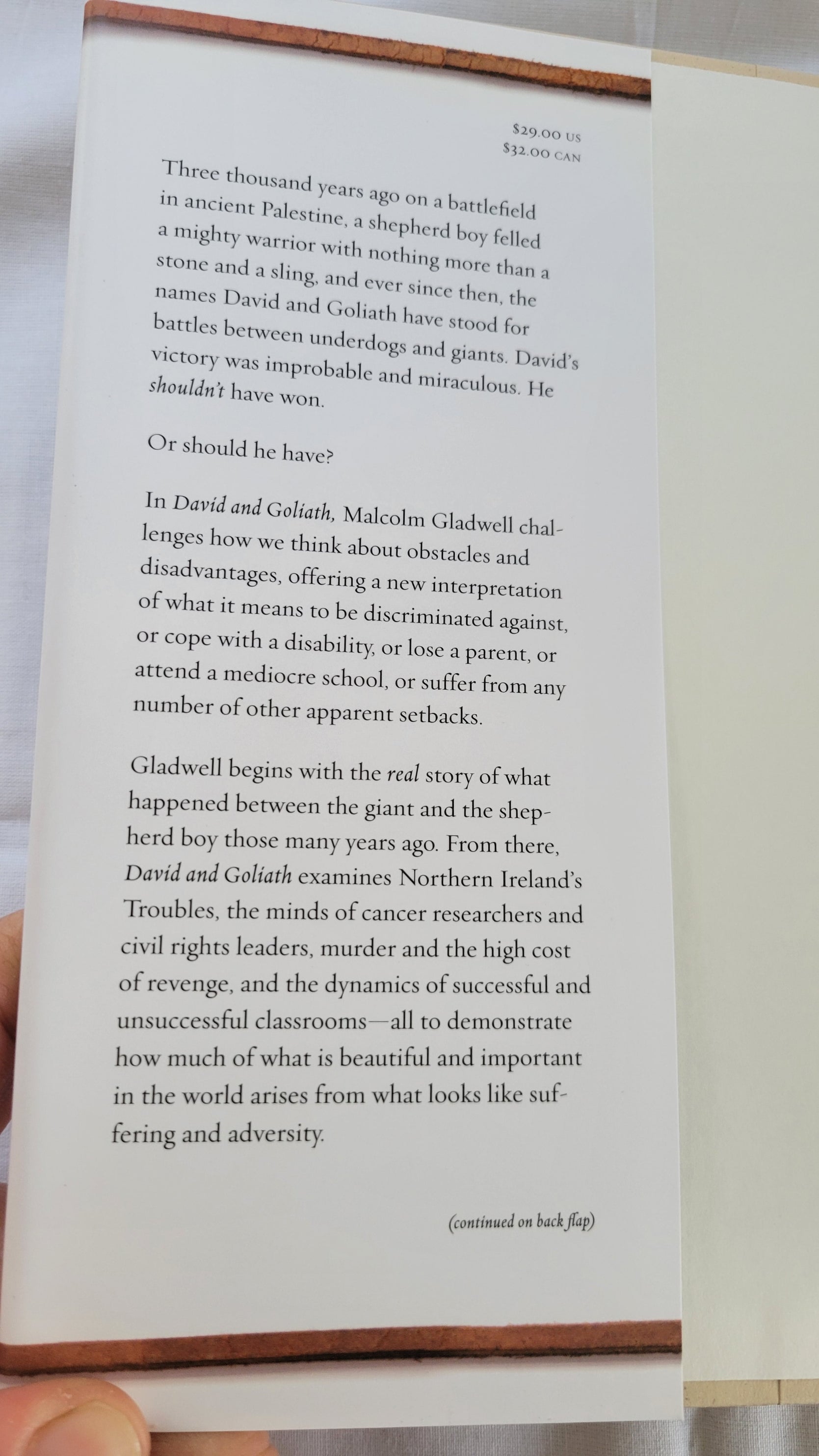 Used book David and Goliath: Underdogs, Misfits, and the Art of Battling Giants, written by Malcolm Gladwell.  View of jacket panel.