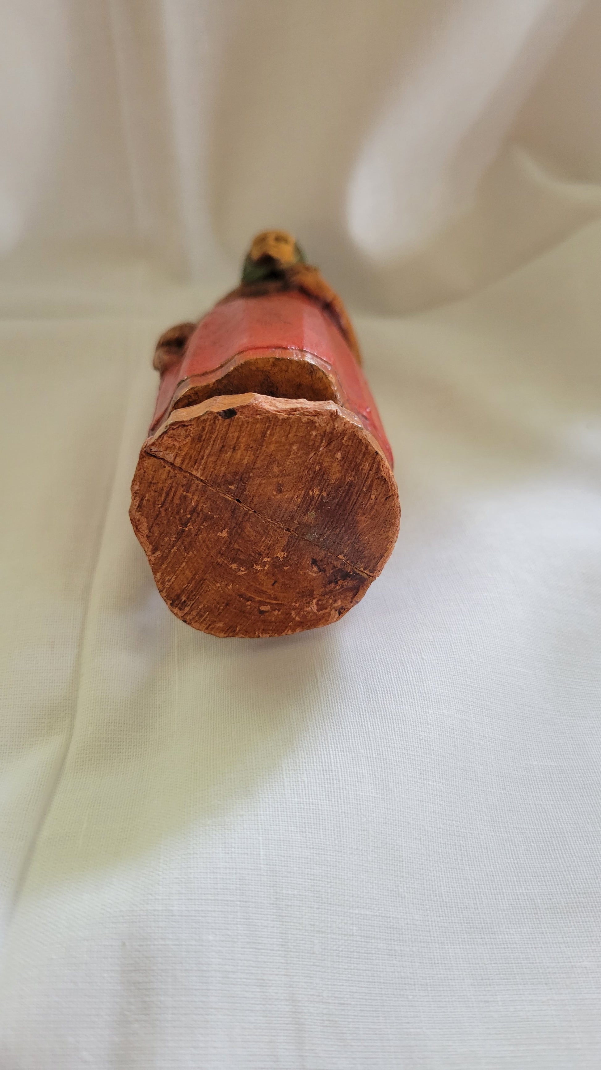 Small Jewish, Yiddish grandmother or Bubbe figure, antique, holding Jewish Bible, possibly SyrocoWood. Bottom view.