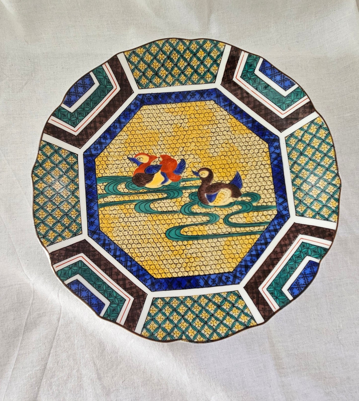 Sanyo Toki Japanese porcelain plate with geometric designs and two mandarin ducks.