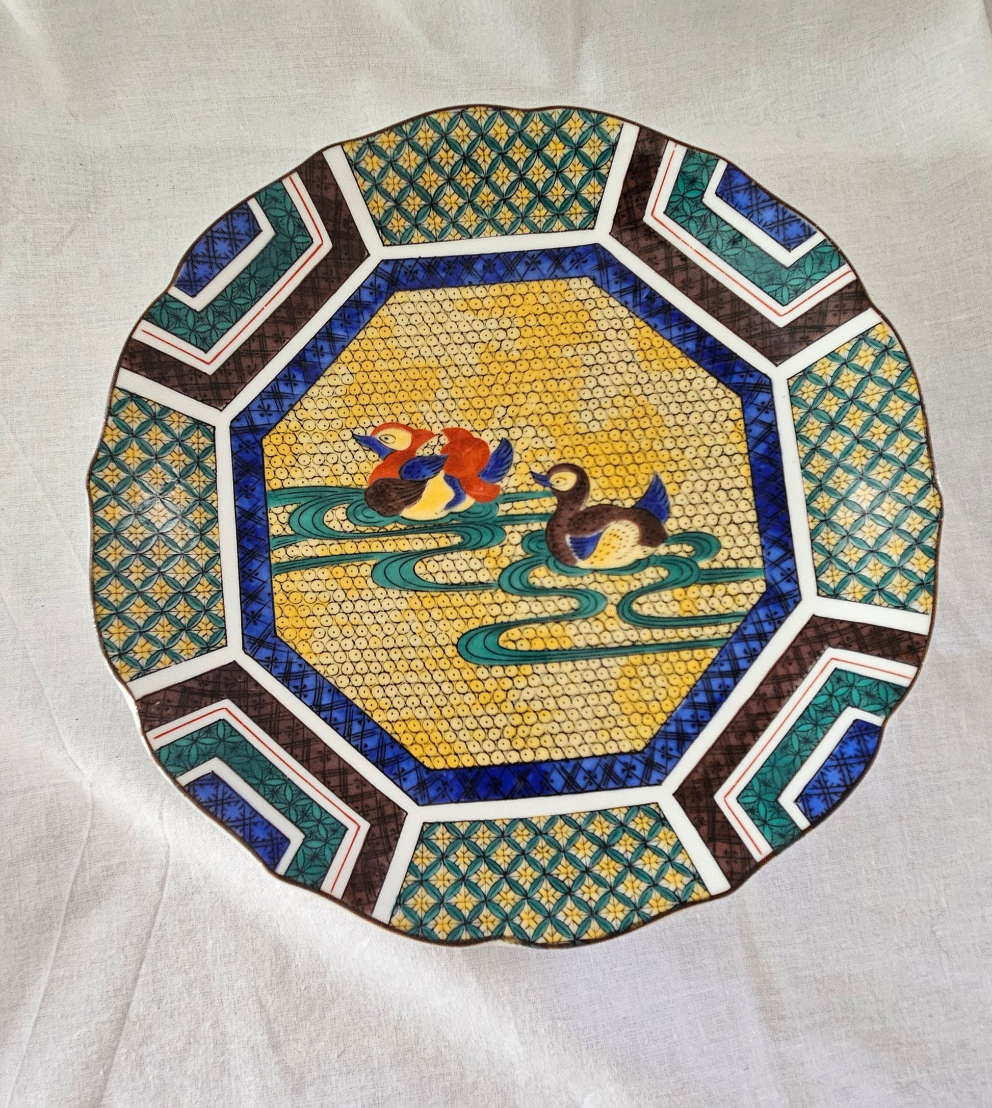 Sanyo Toki Japanese porcelain plate with geometric designs and two mandarin ducks.