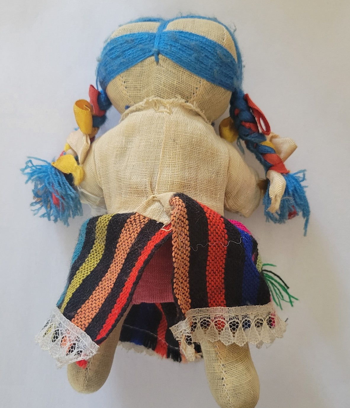 Vintage Mexican rag doll. Back view.