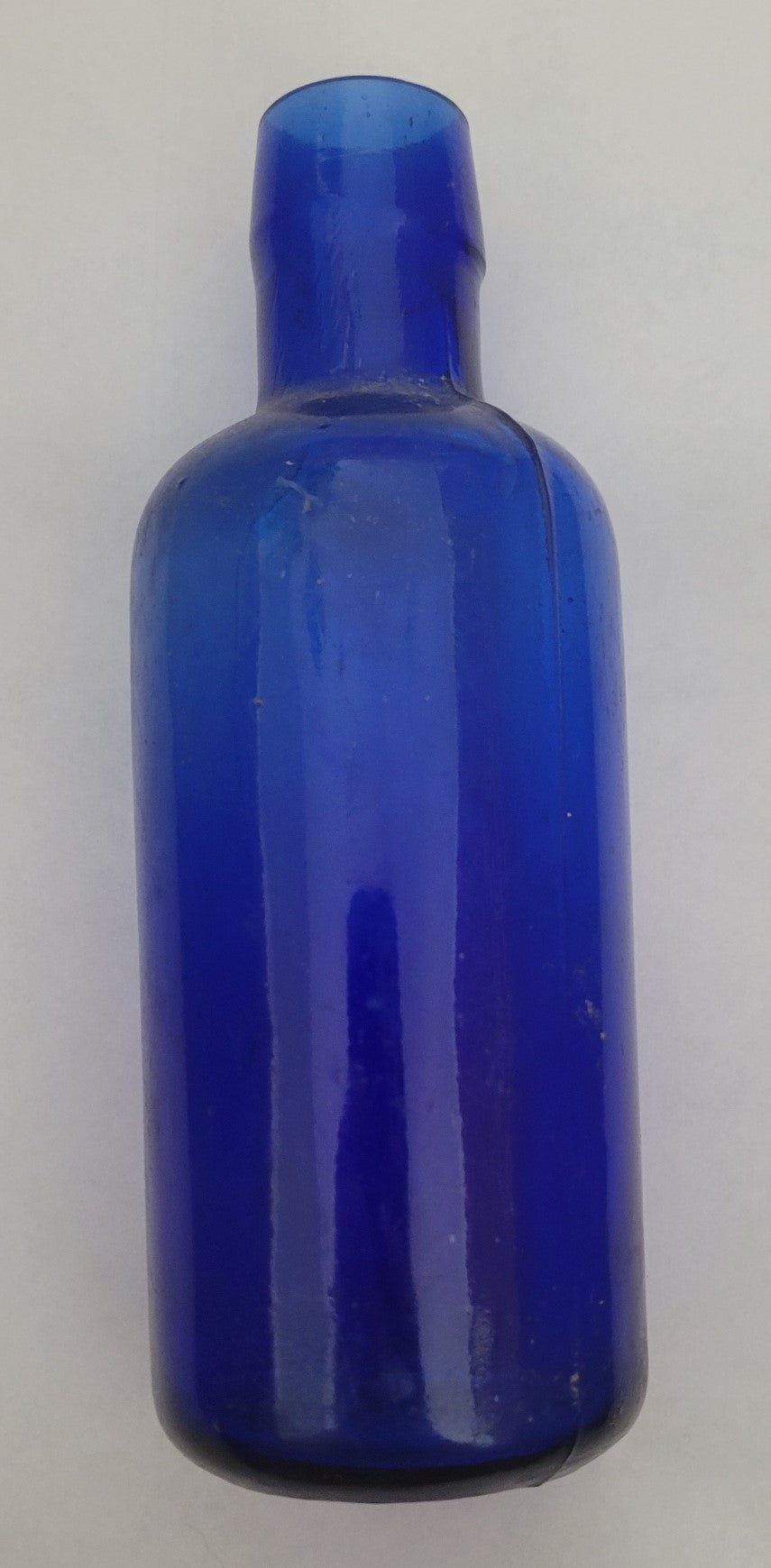 Antique cobalt blue bottle. Bottom markings have "H. K. Mulford Co. Philadelphia" around the edge and "4-S" in middle.  Dates from 1805 - 1929