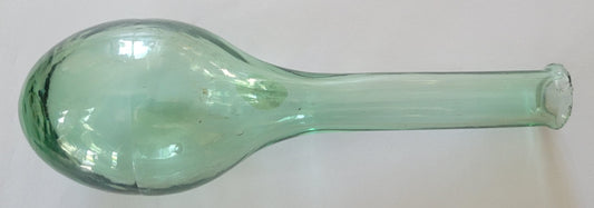 Antique miniature torpedo bottle, made with clear light green glass.