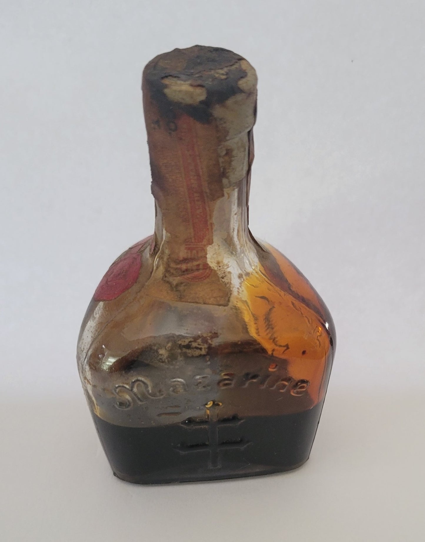 Vintage liquor bottle, little Mazarine liquor bottle from Argentina with State of Maryland Liquor Excise Tax sticker on the front. Second back view.