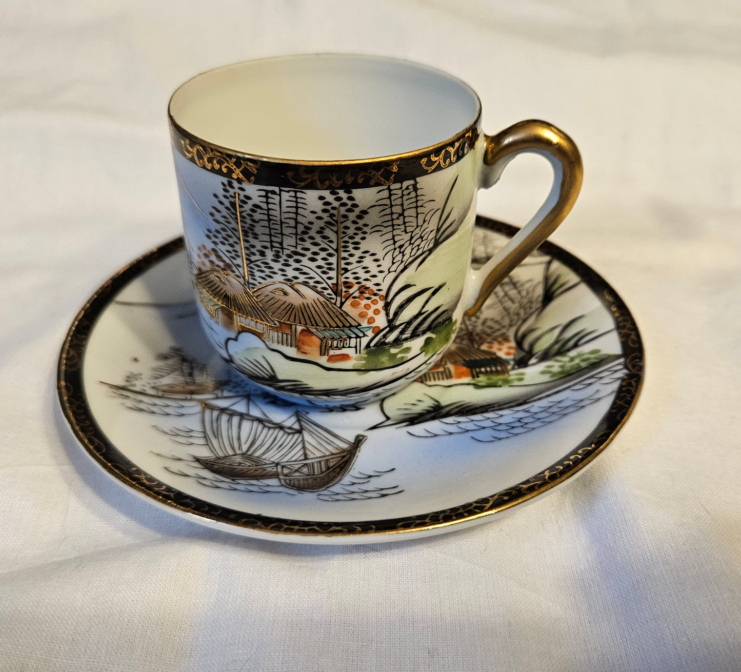Vintage Japanese lithophane teacup and saucer with image of woman on bottom of cup