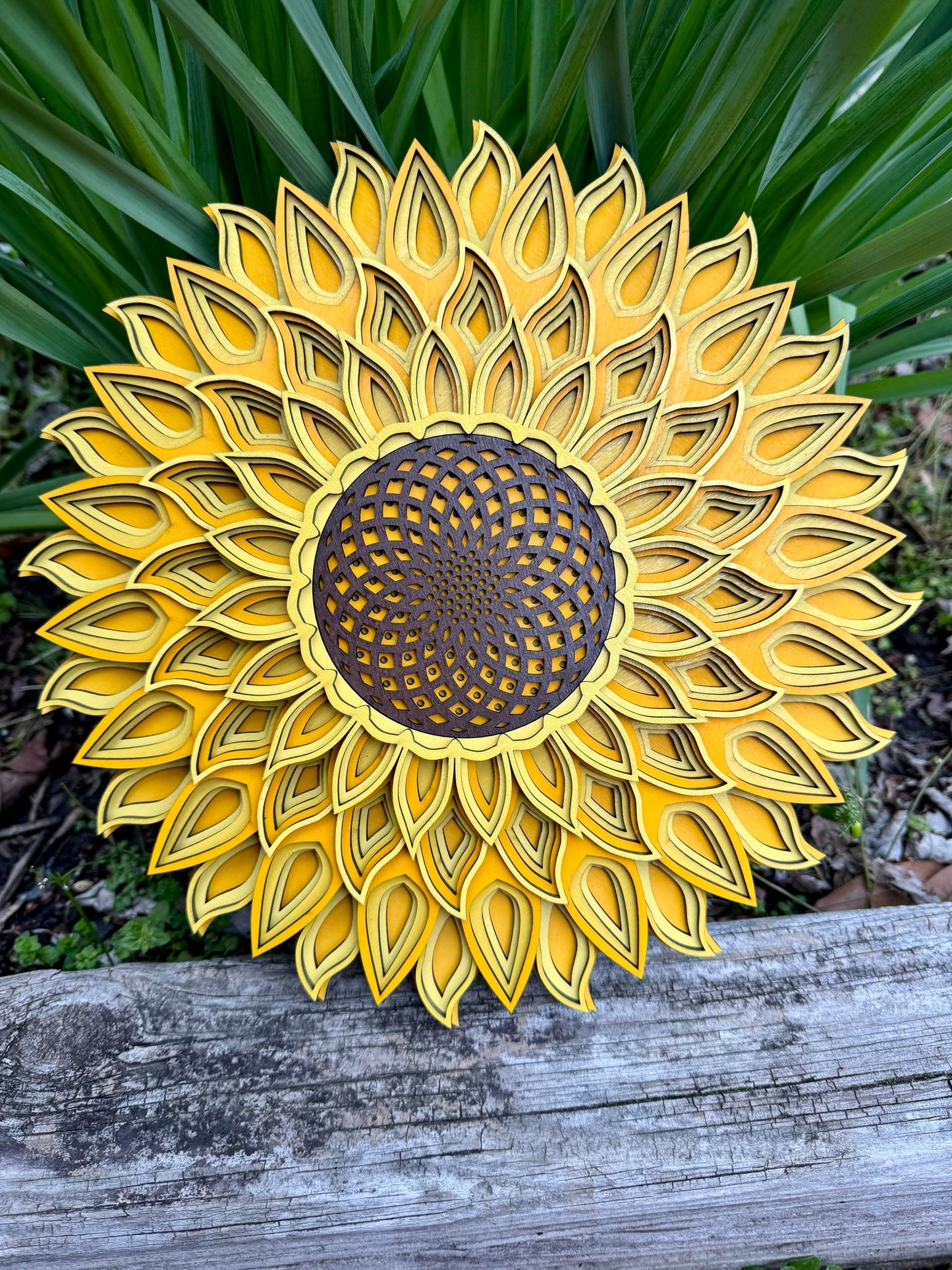 A beautiful sunflower mandala, painted with bright shades of yellow, a favorite flower among gardeners and artists alike.