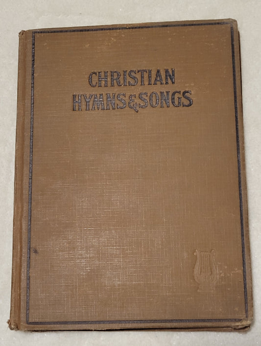 An antique book of Christian hymns and songs, published by Hall-Mack Co in Philadelphia in 1931. Front view.