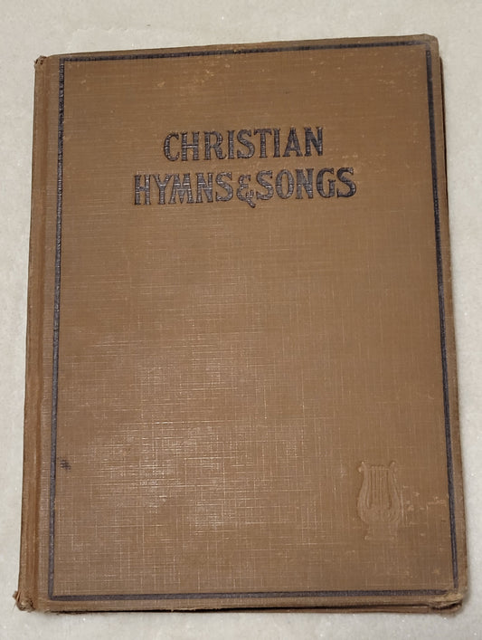 An antique book of Christian hymns and songs, published by Hall-Mack Co in Philadelphia in 1931. Front view.