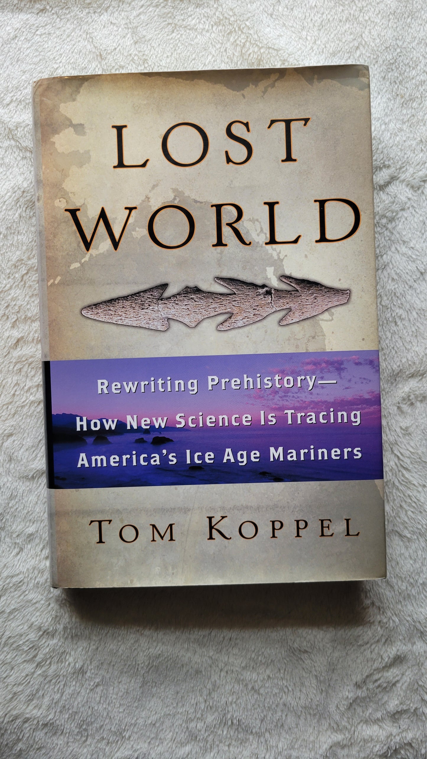 Used book for sale, "Lost World: Rewriting Prehistory – How New Science is Tracing America’s Ice Age Mariners" written by Tom Koppel, published by Atria Books, 2010. View of front cover.  