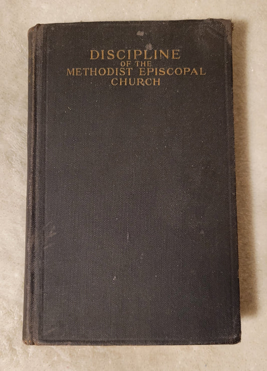 Antique book "Doctrines and Discipline of the Methodist Episcopal Church" published by the Methodist Book Concern, 1912. View of front cover.