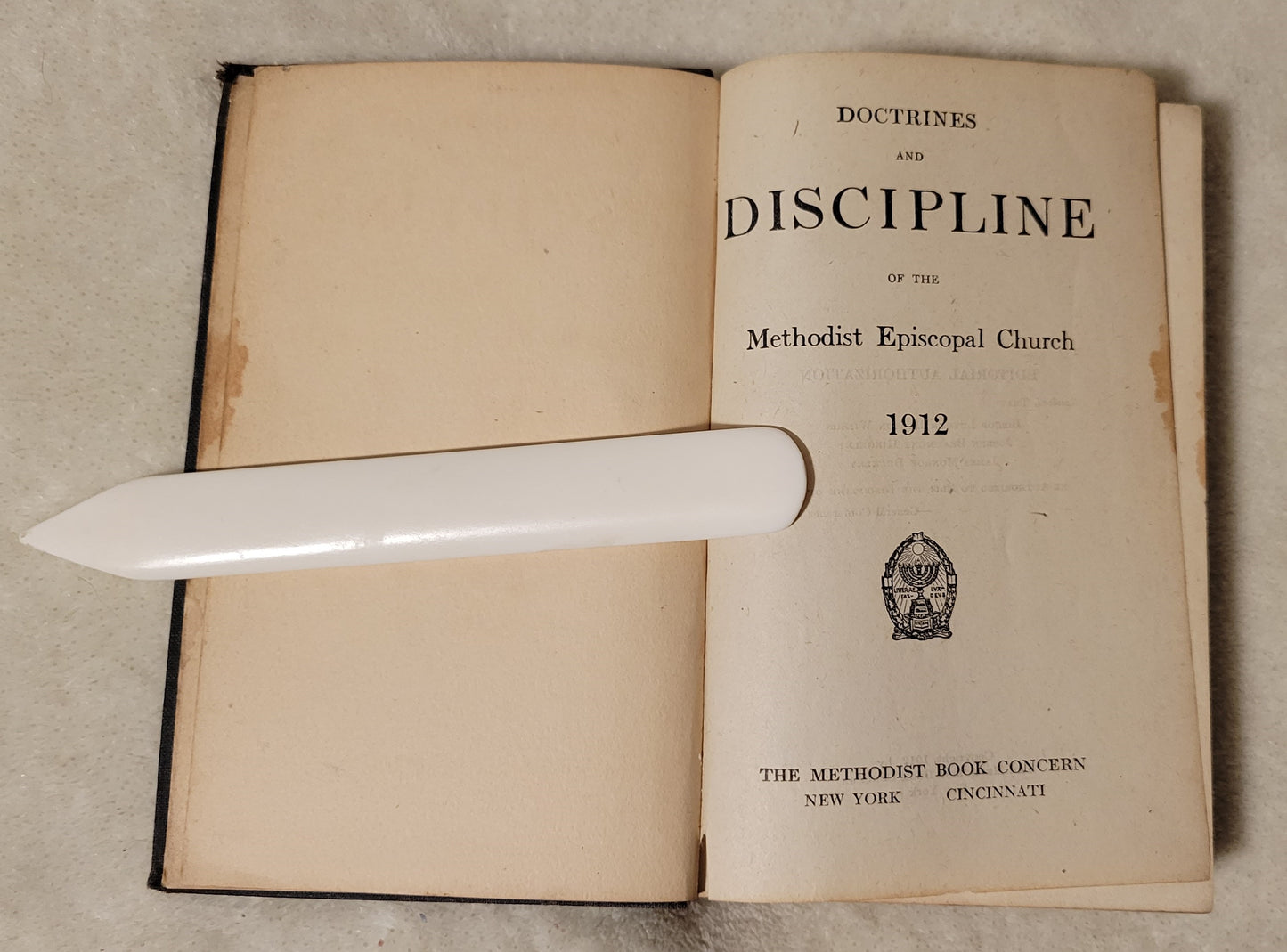 Antique book "Doctrines and Discipline of the Methodist Episcopal Church" published by the Methodist Book Concern, 1912. View of inside title page.