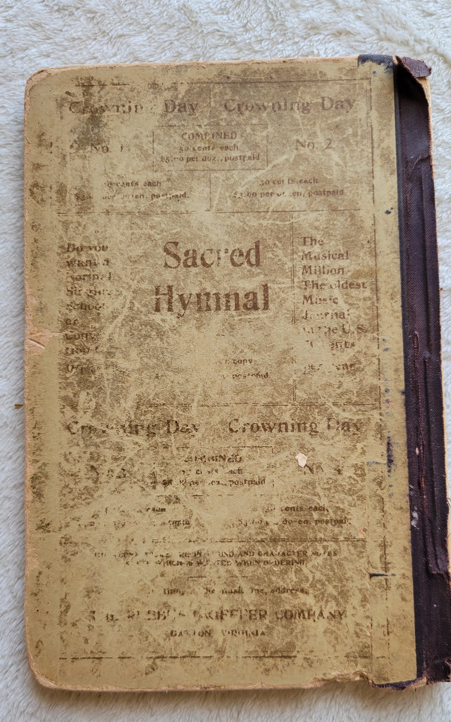 Antique book Crowning Day No. 5 is a Christian hymn book, copyrighted in 1902 by J. H. Hall, W. H. Ruebush, and J. H. Ruebush and published by the Ruebush-Kieffer Company, Dayton, Virginia.  View of back cover.