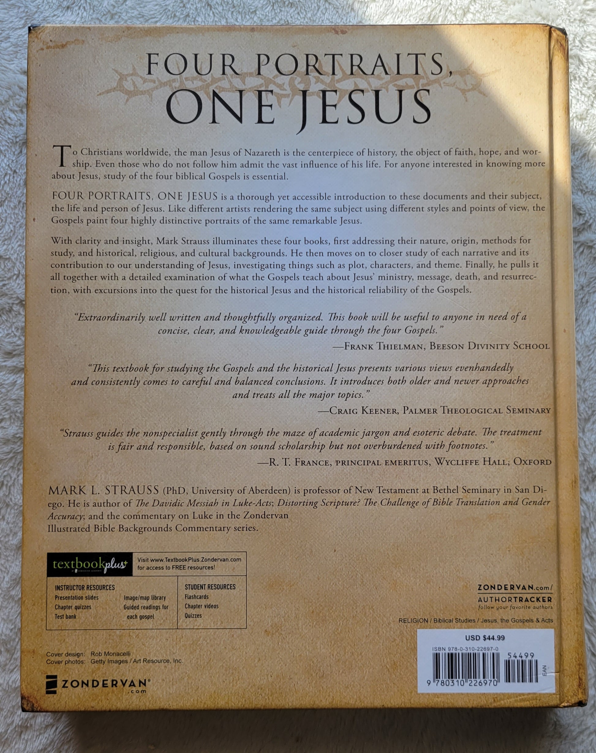 Used book for sale, "Four Portraits One Jesus: A Survey of Jesus and the Gospels", written by Mark L. Strauss in 2007, published by Zondervan.  Investigating the historical Jesus and reliability of the Gospels.  View of back cover.