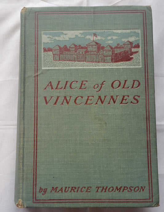 Antique book "Alice of Old Vincennes" by Maurice Thompson, published by The Bowen-Merrill Company in 1900. American Revolution story of Alice Roussillon. When the British retake Vincennes the rallying cry Viva la banniere d'Alice Roussillon is heard throughout the land. The true battle for liberty and love has begun." Size: 5.25" x 7.625" x 1.5" View of front cover.