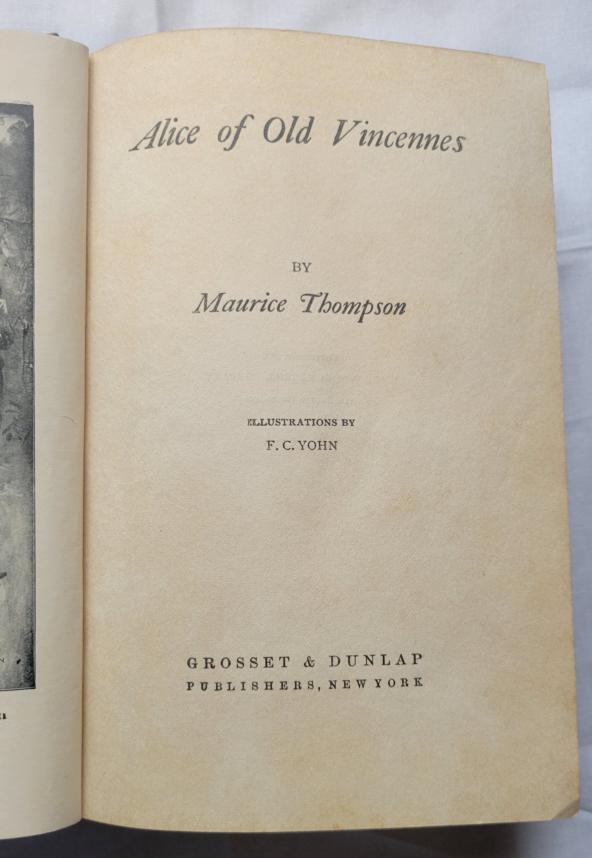 Antique book "Alice of Old Vincennes" by Maurice Thompson, published by The Bowen-Merrill Company in 1900. American Revolution story of Alice Roussillon. When the British retake Vincennes the rallying cry Viva la banniere d'Alice Roussillon is heard throughout the land. The true battle for liberty and love has begun." Size: 5.25" x 7.625" x 1.5" View of title page.