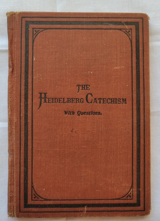 Antique book for sale "The Heidelberg Catechism: With Questions for the Catechetical Class and the Sunday-School by Rec. Aaron Spangler, A.M.", published in 1899 by the Central Publishing House. Front cover.