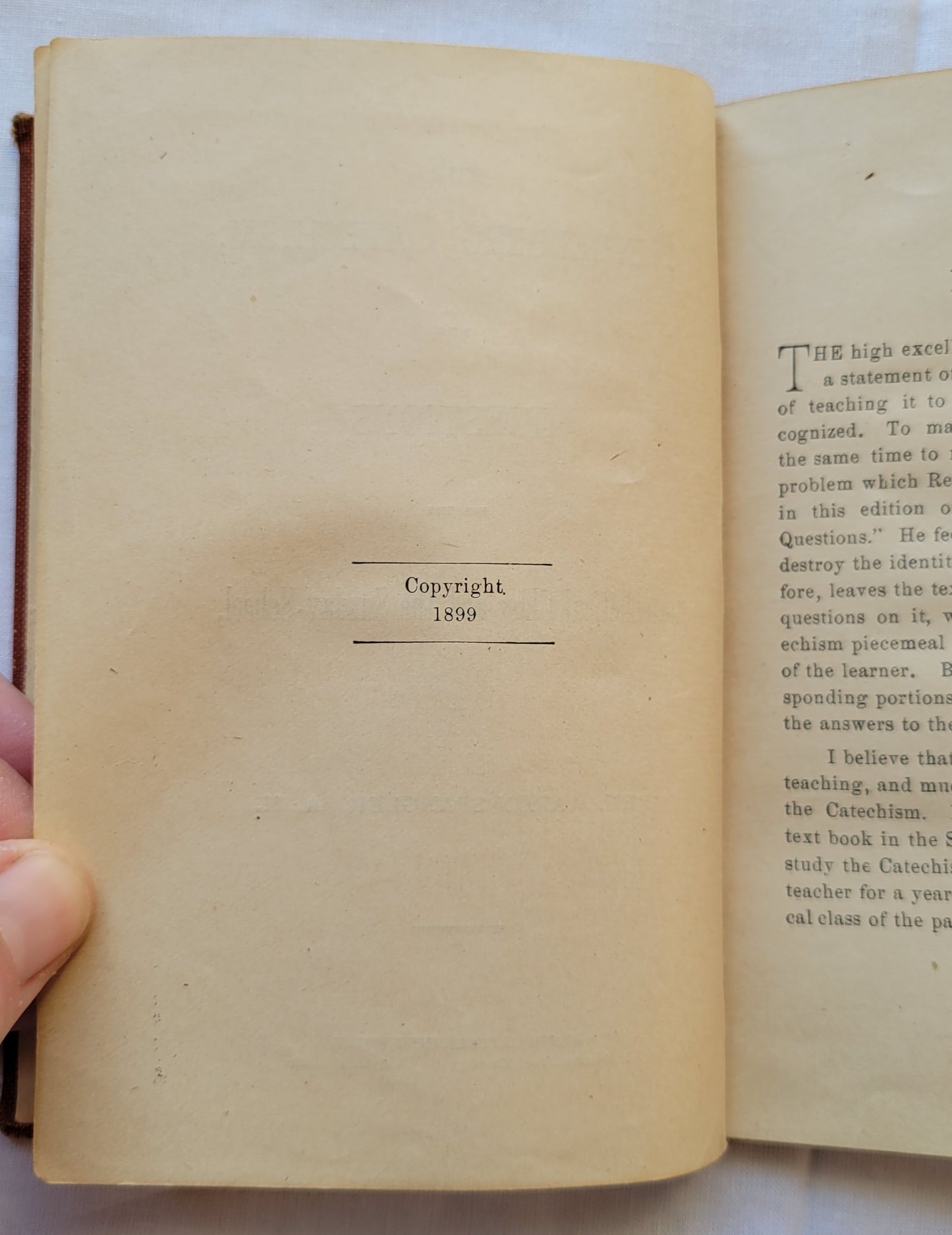 Antique book for sale "The Heidelberg Catechism: With Questions for the Catechetical Class and the Sunday-School by Rec. Aaron Spangler, A.M.", published in 1899 by the Central Publishing House. Copyright info.