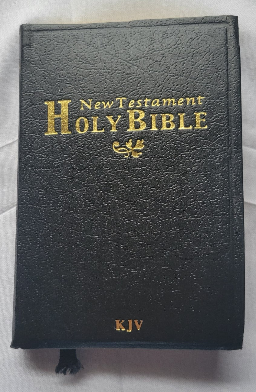 Used book for sale, Pocket size, red letter, King James Version New Testament. Front view.