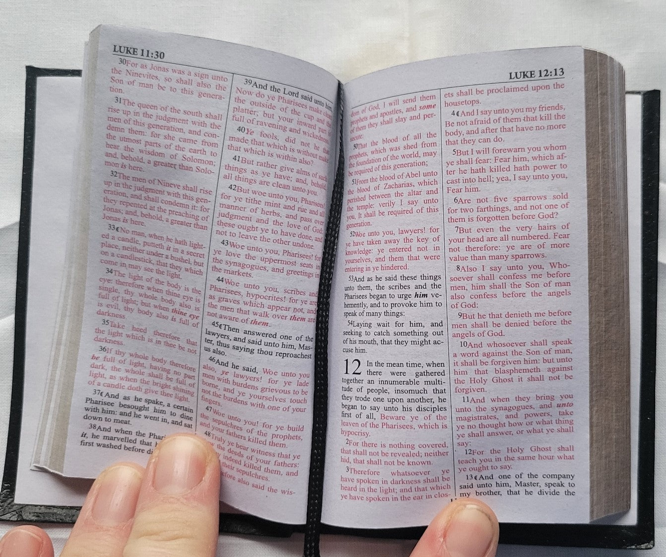 Used book for sale, Pocket size, red letter, King James Version New Testament. View of interior page.