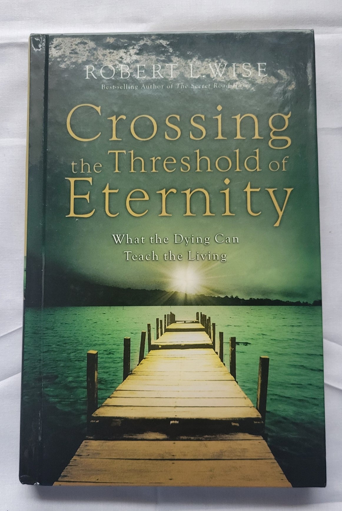Used book "Crossing the Threshold of Eternity: What the Dying Can Teach the Living" by Dr. Robert L. Wise, published by Gospel Light, 2007. View of front cover.