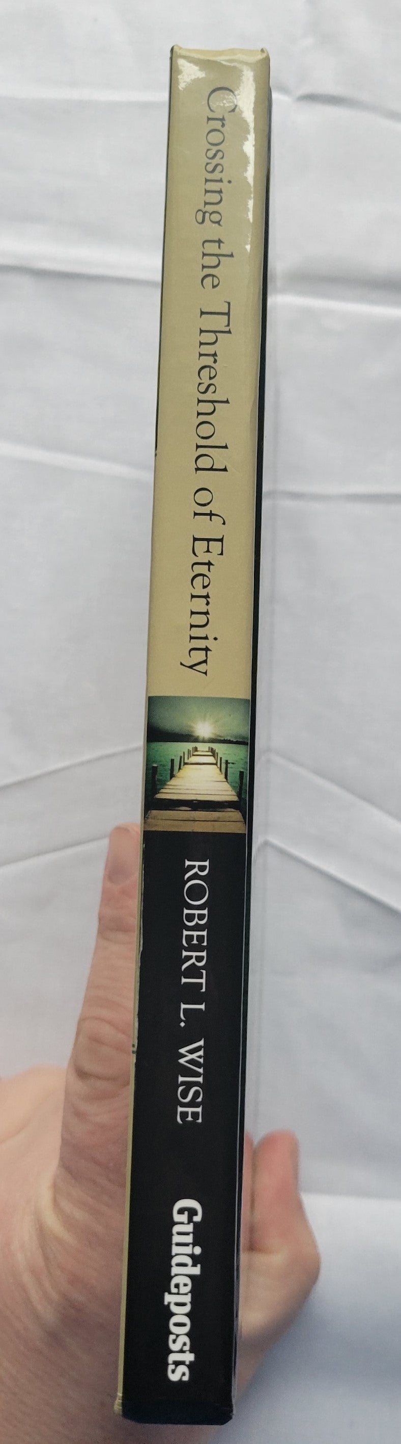 Used book "Crossing the Threshold of Eternity: What the Dying Can Teach the Living" by Dr. Robert L. Wise, published by Gospel Light, 2007. View of spine.