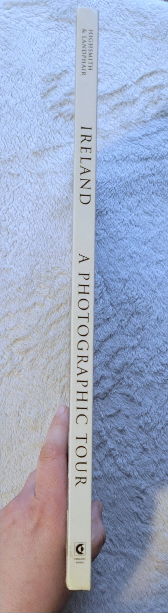 Used book for sale, travel photography, “Ireland: A Photographic Tour” by Carol W. Highsmith and Ted Landphair, published by Random House, 1998. View of spine.