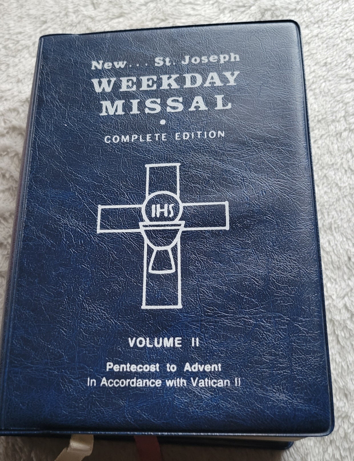 Vintage book for sale, "New....St. Joseph Weekday Missal Vol 2: Advent to Pentecost" Complete Edition, by the Catholic Book Publishing Company, "In accordance with Vatican II". View of front cover.