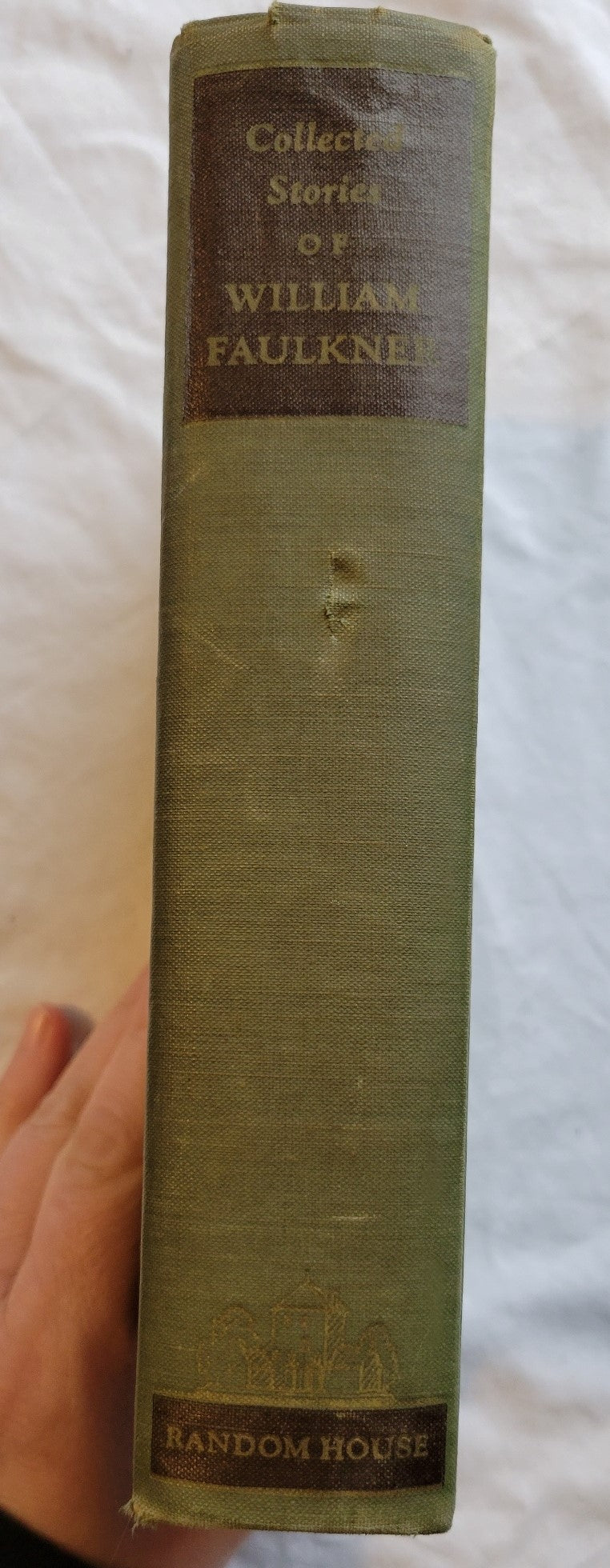 Vintage book. "Collected Stories" by William Faulkner, published by Random House. View of spine.