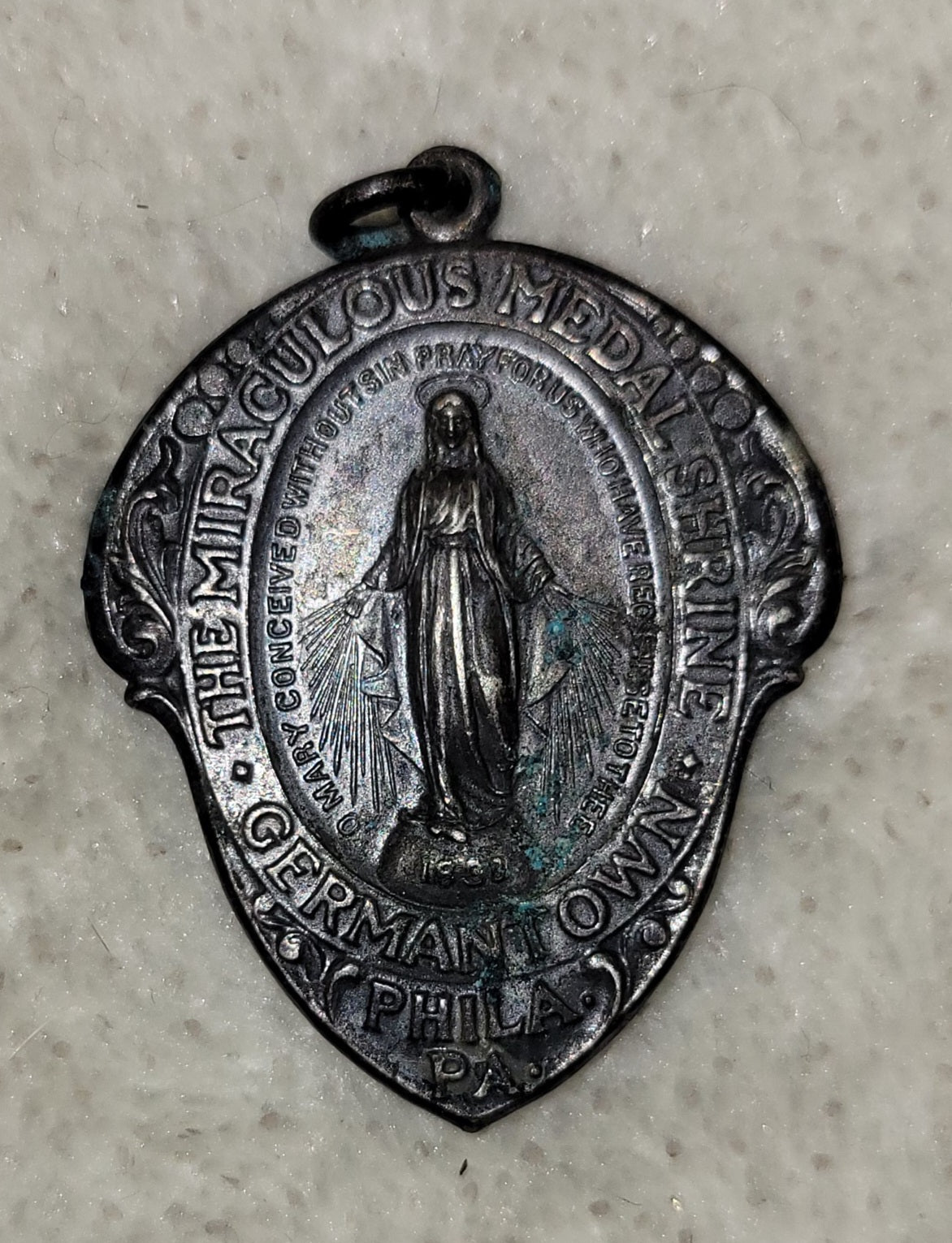 Antique medal The Miraculous Medal Shrine Pendant Germantown PA revealed to St. Catherine Labouré at the Rue de Bac Chapel in 1830 by the Virgin Mary herself. Front view.