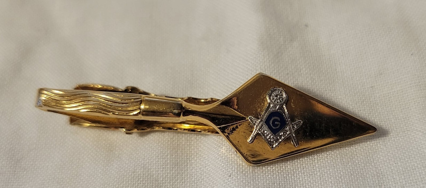 Collectible Masonic gold tie clip with Freemason square and compass.
