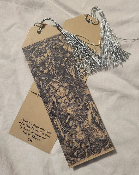 Handmade bookmark by Phoenix Feather Books & Curios, laminated bookmark, decorated with the Mask and Eagle Between Two Fauns engraving by German Renaissance artist Heinrich Aldegrever, 1549.  Size: 2.25" x 7"